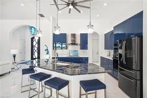 Look at this very modern kitchen that opens onto the lanai.