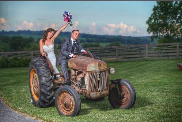 This is my niece she had her wedding at our farm this year and she is on her grandfathers 1930 Ford tractor