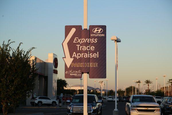 New flat black real estate sign with pole wrap and LED lights. Single post with wind release. Call for details.