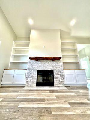 Custom fire place with handmade live edge wooden mantle