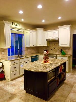 Kitchen Remodel: Siena Bordeaux Granite, Travertine Tile Backsplash, Off White Maple Cabinets and Espresso Island.