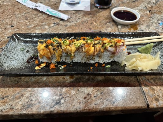 Corey Roll (Spicy Salmon, Spicy tuna, Avocado inside, tuna, salmon on top, seared with chefs special sauce.