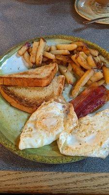 Eggs, bacon, home potatoes & sour dough toast; home fries were so delicious..