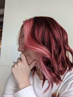 Rich, multidimensional cool red with a pink money piece. She added some pink highlights underneath for dramatic effect when I wear it up!