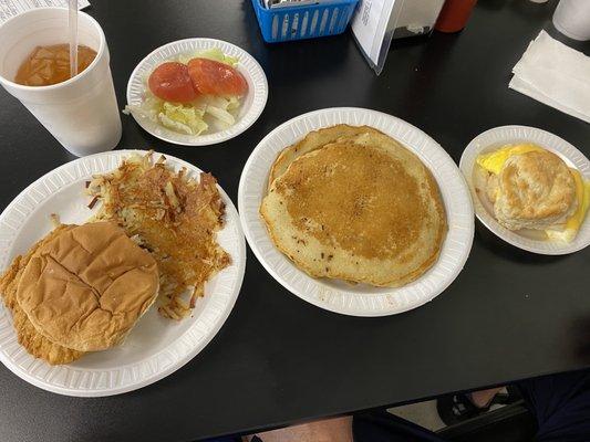 The Chick-Fil- A, hash browns, pancakes, egg and cheese biscuit