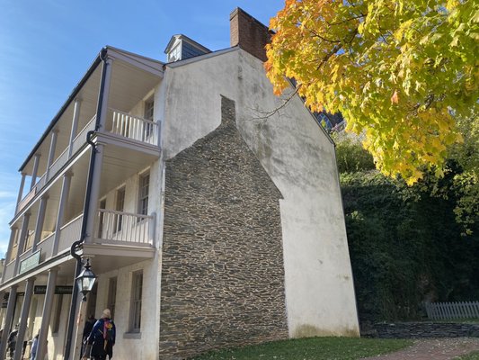 Historic three story building with the footprint of the building that used to stand next to it.