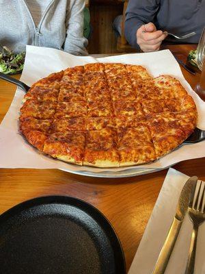 Large cheese pizza with thick crust