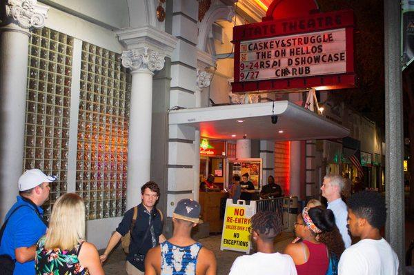 Lead storyteller and historian, Jon, telling a spooky tale outside of the historic State Theatre