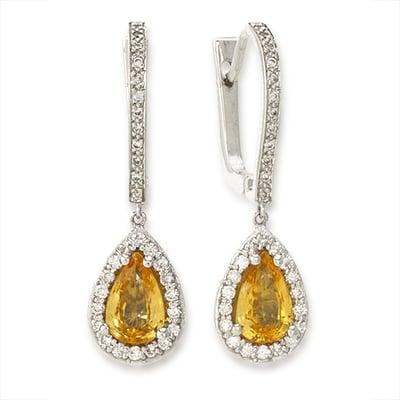 These yellow sapphires are dazzling in 18k white gold surrounded by diamonds.