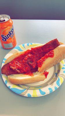 Small eggplant parm sub with an orange soda to drink