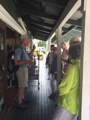 Kent and tour group tasting Maui Gold Pineapple. Yum!