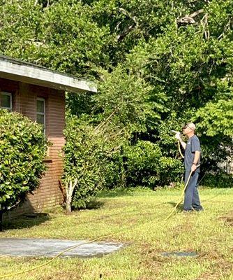 Seth getting the eaves for wasps and spiders