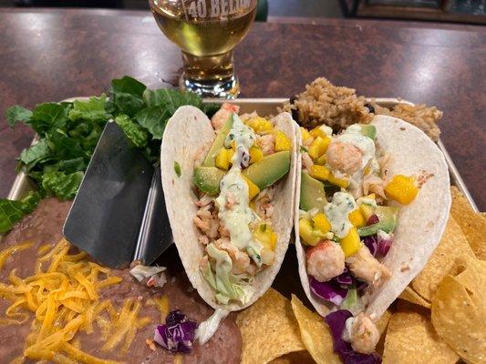 Taco trio with lobster and special mango sauce.