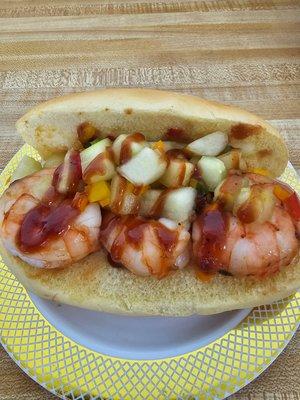 BBQ  shrimp on a potato roll  topped w a cucumber salsa