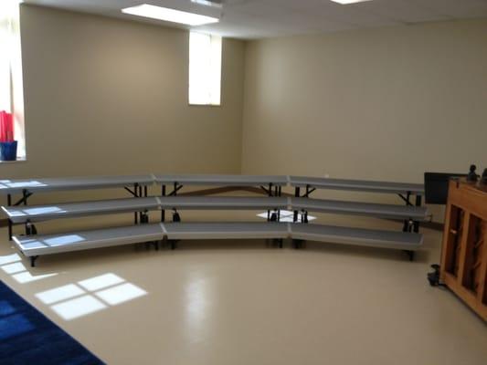 The music room has a mini stage and drums and a piano! (during open house)