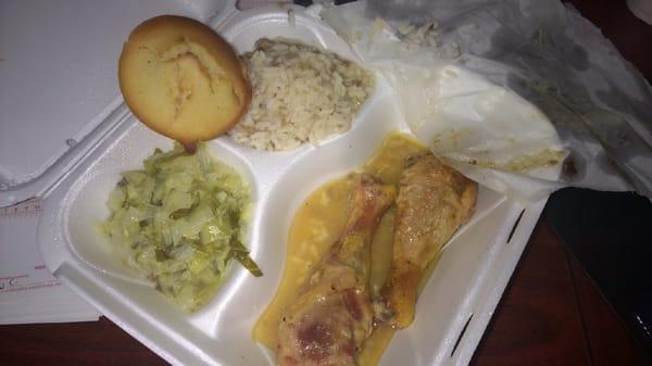 Baked chicken with rice & gravy, cabbage and cornbread roll.