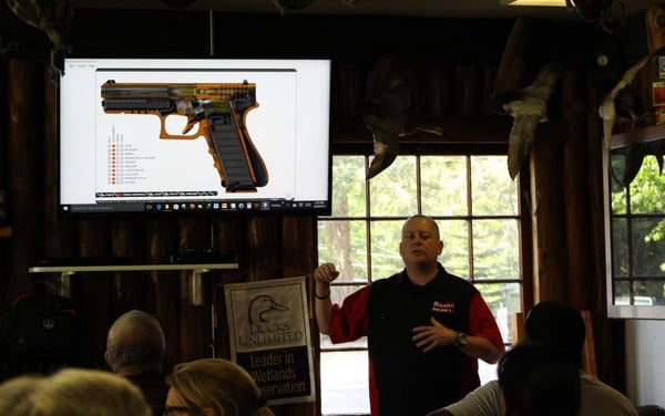 Classroom teaching pistol operation.