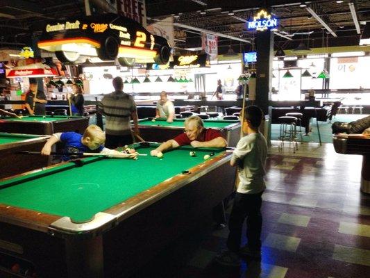 Nathaniel Learning to play pool with Denny Stewart, Certified Pool Instructor.