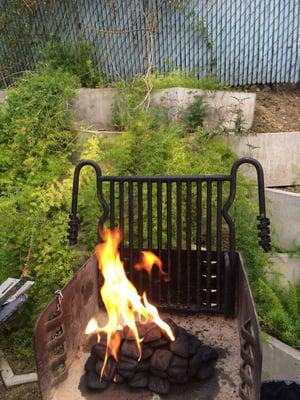 Starting up the BBQ next to pool.