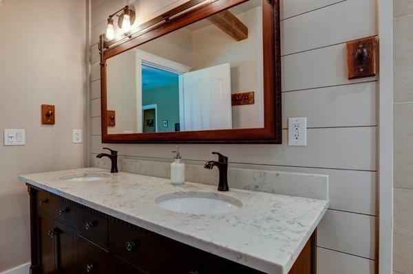 Gorgeous Northwest Crossing master bathroom renovation. The mirror is uniquely hung on a sliding door track (although it doesn't move).