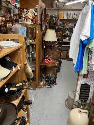 Another section of the old farm antique booth. They also had hats, clothes, cast iron pans, even a bottle made from a cow foot.