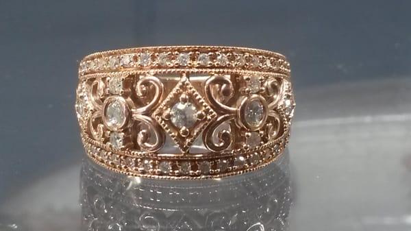 This beautifully crafted  elegant 14k rose gold and diamond band will look lovely with any skin tone.