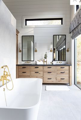 Primary bathroom featuring a rustic White Oak vanity. Featured on Houzz.com.