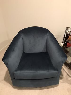 Accent swivel chair in peacock microfiber.