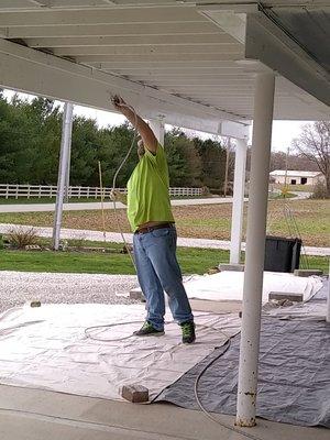 Pressure wash carport deck area and sprayed paint