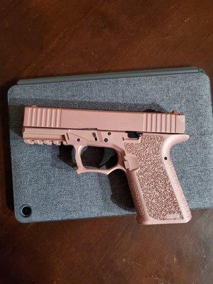 Rose gold Cerakote Glock 19.