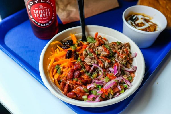 Eggplant and Beef Rice bowl, side of banjan and a boylan soda