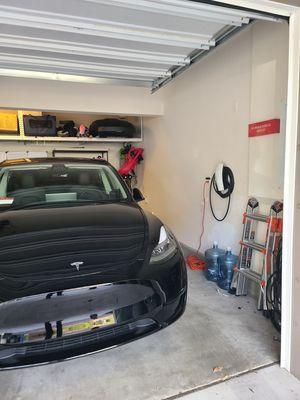 EV charging station in garage.