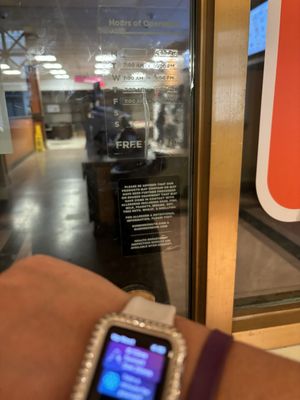 My watch which would read 4:46pm if it wasn't so fuzzy, the door says closes at 5 and a worker pushing a big bin ignoring us.