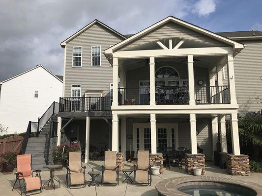 A great second story porch and deck to connect to this back yard paradise.