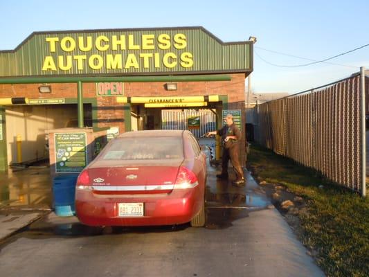 Attendant spraying for bugs and also the front wheels.