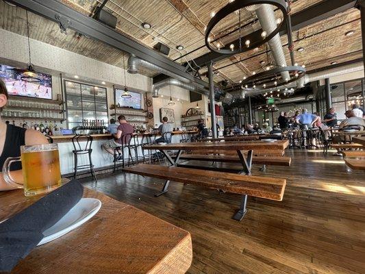 Bar and main seating area with large fest tables throughout