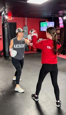 9ROUND Studio owner "Right Hook" Rikki showcasing her trainer skills working the focus mitts with our amazing member "Pro Leather" Heather