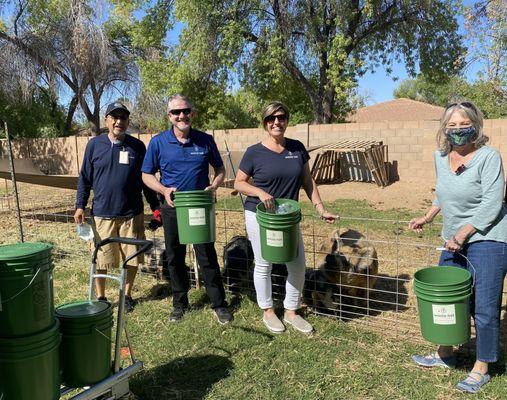 Waste Not Executive Director and Director of Operations feed the animals at Heartquist Hollow Farm.