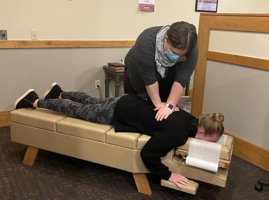 Patient getting adjusted by Dr. Julie