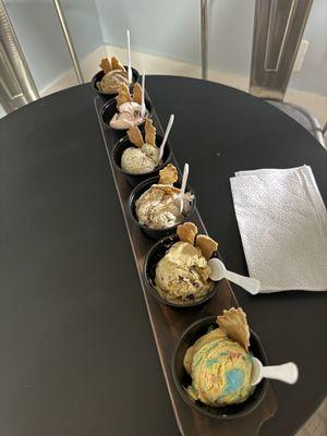 Ice Cream Flight Left to right: Mocha Latte, Peppermint Bark, Cookies n Creme, Churro, S'mores, Birthday Cake