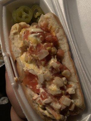 Hotdog MTY con todo They had topped & packaged the dog neatly but I messed it up to distribute the toppings evenly.