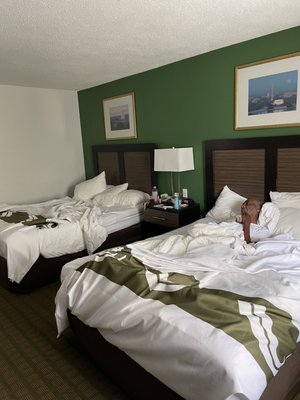 Two queen size beds on other side of a rather large room