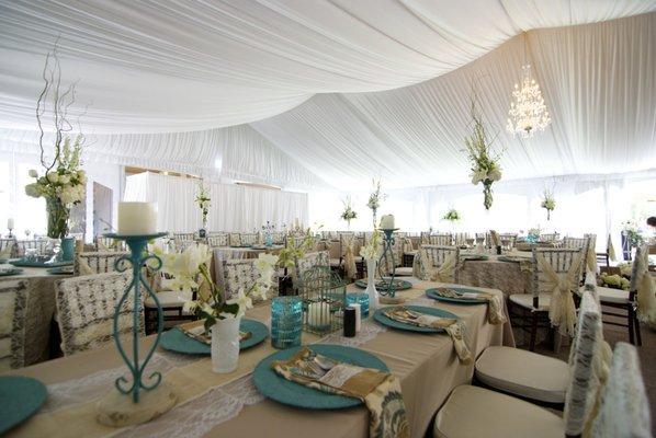 Wedding reception in a tent with a white liner.