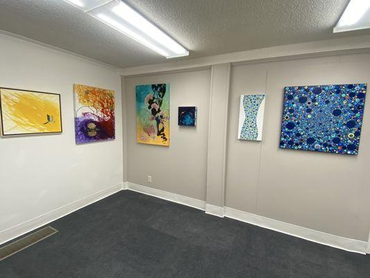 Four of Selena Valenti's paintings and 2 by Erin Burress