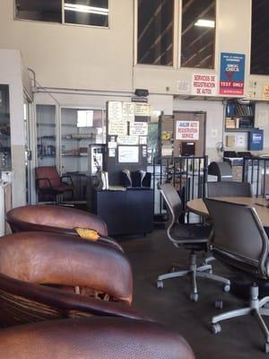 Seating area for customers. Complete with funny mechanic-shop signs. :D