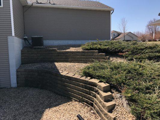 Before- leaning retaining wall re-build.