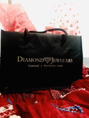 Specialty Diamonds... The only place he'll go Diamond Jeweler Bag laying upon a Free Scarf with purchase...Customer Appreciation...