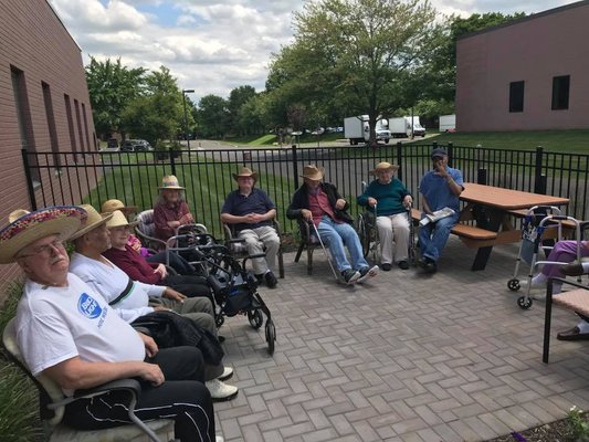 Men's club enjoying a regroup outside in the fresh air.