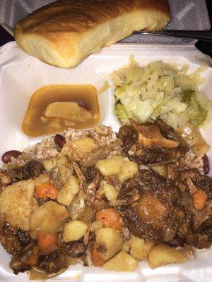 Oxtail stew, red beans and rice, cabbage. Coco bread up top. It was all really good.