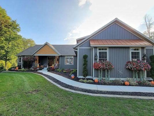 Beautiful exterior with impeccable landscaping to enhance the curb appeal of the home.